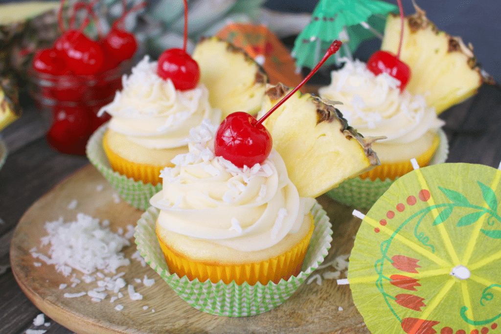 The classic Pina Colada cocktail turned into a cupcake! Pineapple and coconut baked into a moist, delicious cake and then topped with an amazing coconut cream cheese frosting. The perfect to celebrate any occasion!
