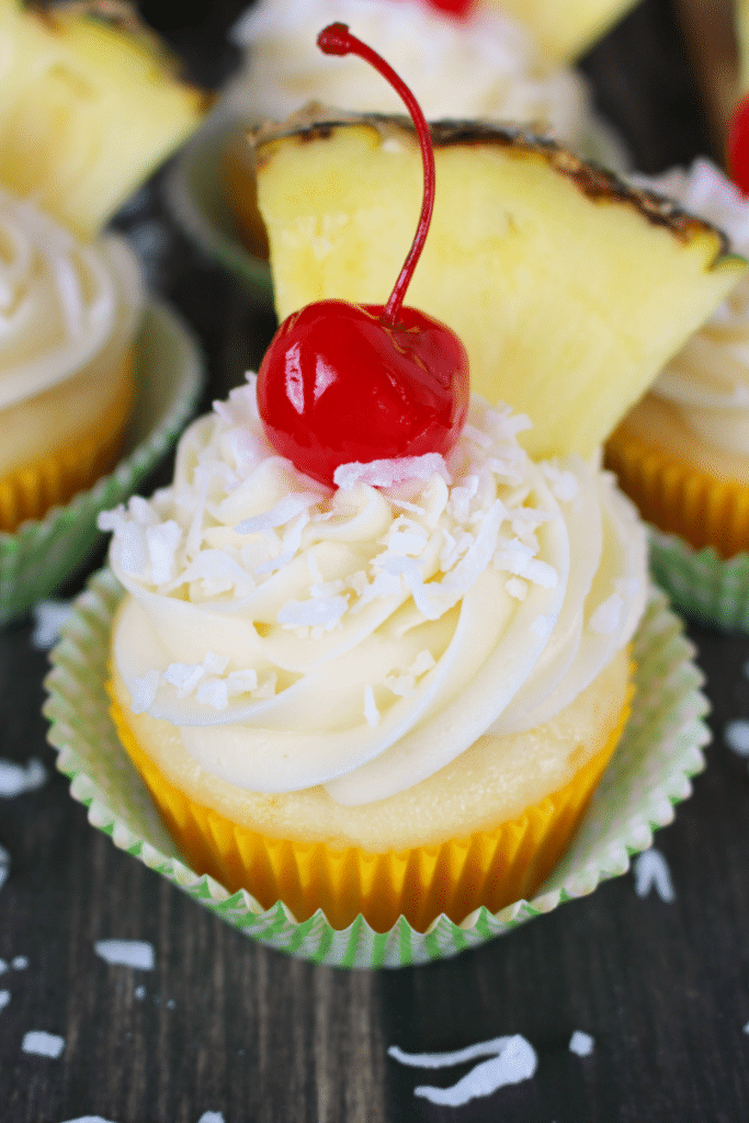 The classic Pina Colada cocktail turned into a cupcake! Pineapple and coconut baked into a moist, delicious cake and then topped with an amazing coconut cream cheese frosting. The perfect to celebrate any occasion!