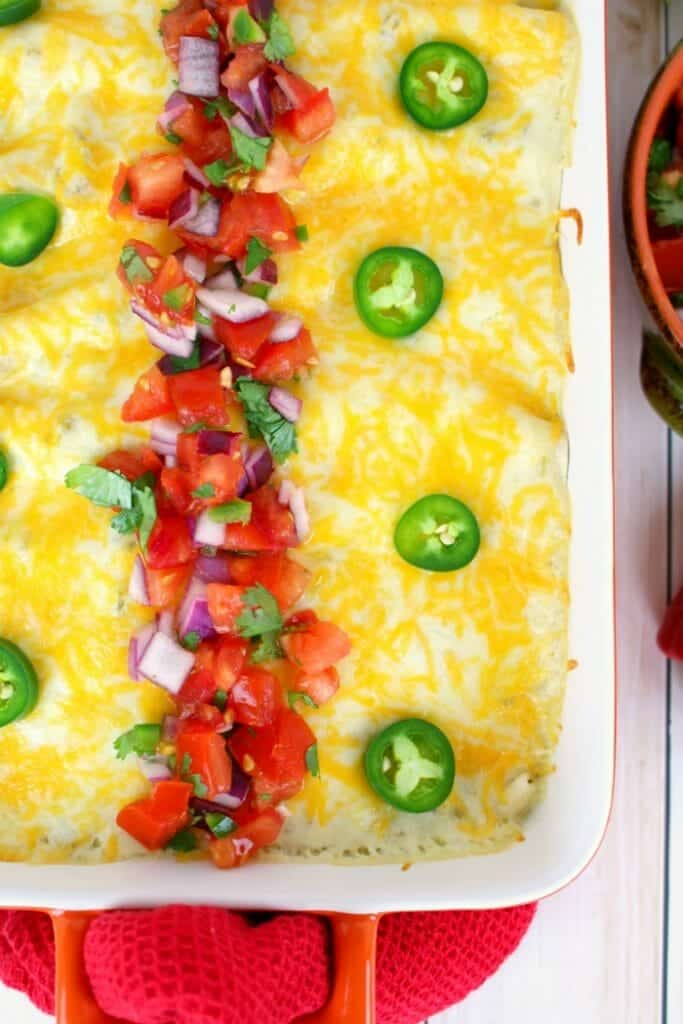 The best beef enchilada recipe on the internet!  Stuffed with seasoned ground beef and cheese, smothered with a delicious sour cream sauce, topped with more cheese and baked to perfection. These Beef Sour Cream Enchiladas are incredible!