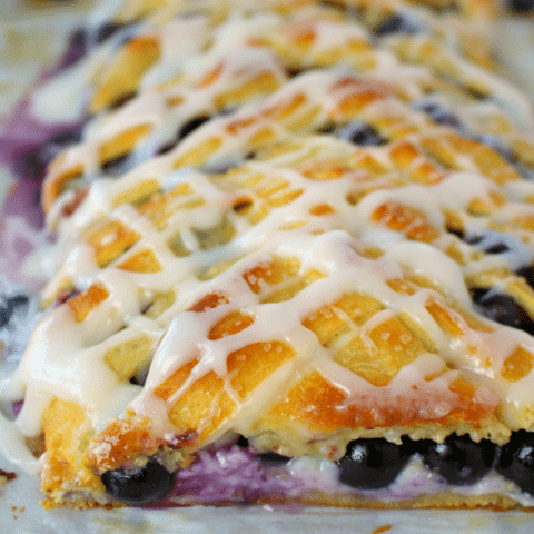 Meet your new favorite breakfast pastry! This super-simple Blueberry Cream Cheese Breakfast Braid is made from store-bought crescent sheets, along with fresh blueberries, and almonds and a baked to perfection. The perfect pairing with your morning coffee!