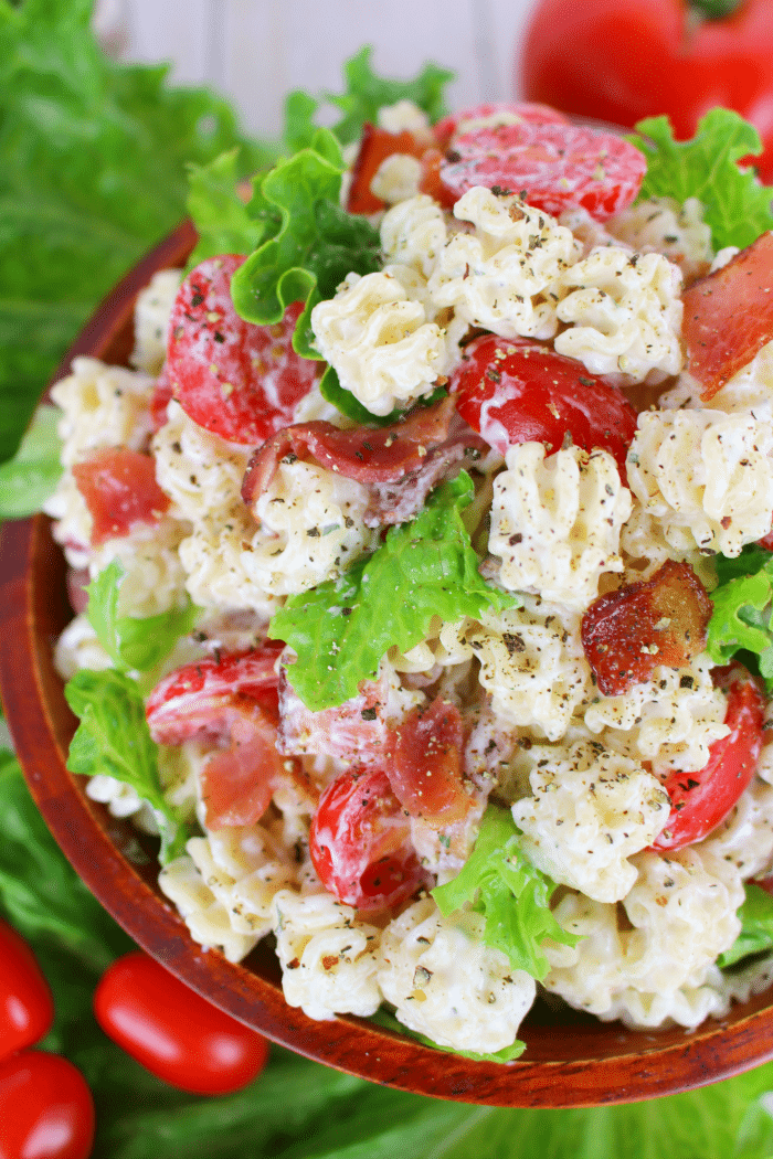 The perfect side dish for any potluck, cookout, picnic or back yard BBQ! This Creamy Ranch BLT Pasta Salad is loaded with bacon, tomatoes, crisp green leaf lettuce, and topped with an amazing creamy ranch dressing! Make extra - this disappears FAST!!