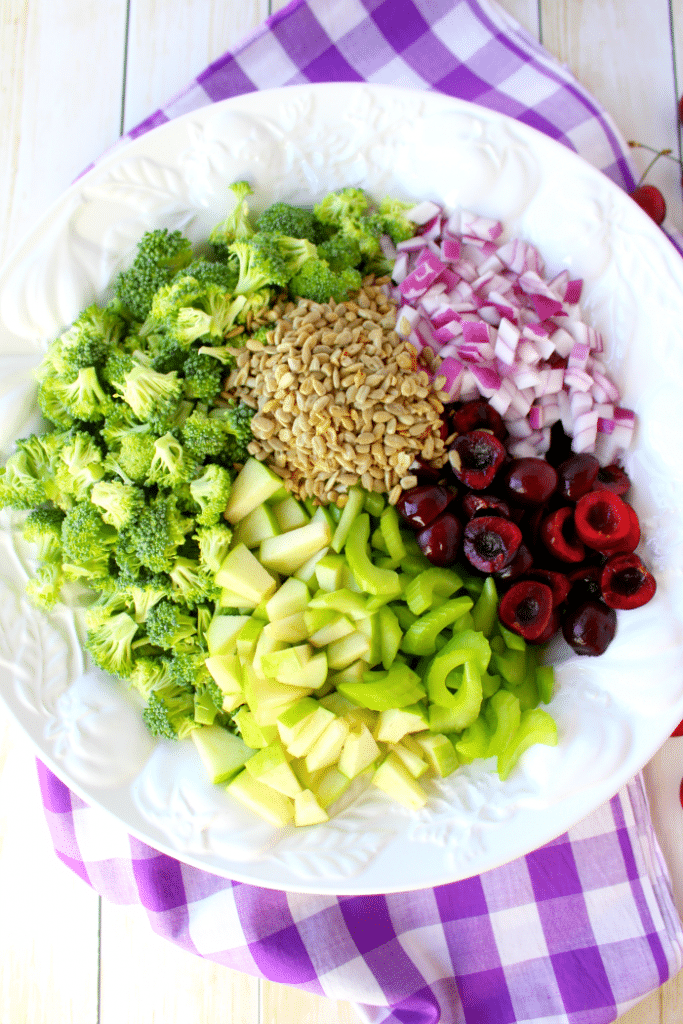 This Healthy & Easy Broccoli Salad recipe is a fantastic side dish, loaded with amazing flavor and crunch!  Fresh cherries, apples and a simple Greek yogurt dressing make this the best broccoli salad recipe that can be enjoyed any time of year!