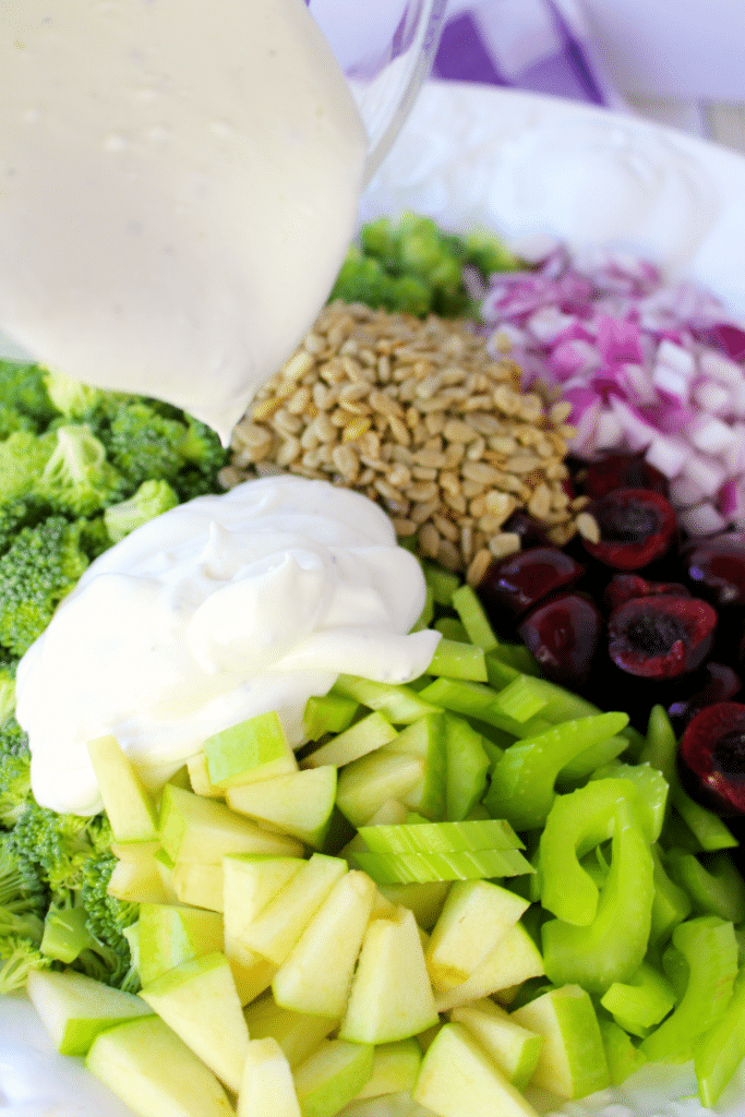 This Healthy & Easy Broccoli Salad recipe is a fantastic side dish, loaded with amazing flavor and crunch!  Fresh cherries, apples and a simple Greek yogurt dressing make this the best broccoli salad recipe that can be enjoyed any time of year!