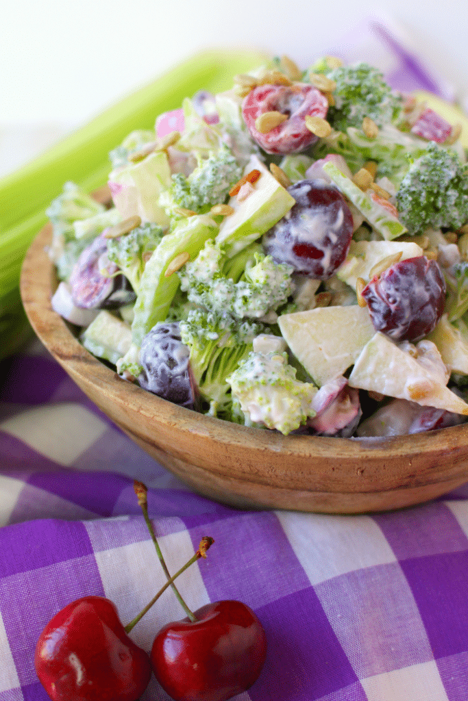 This Healthy & Easy Broccoli Salad recipe is a fantastic side dish, loaded with amazing flavor and crunch!  Fresh cherries, apples and a simple Greek yogurt dressing make this the best broccoli salad recipe that can be enjoyed any time of year!