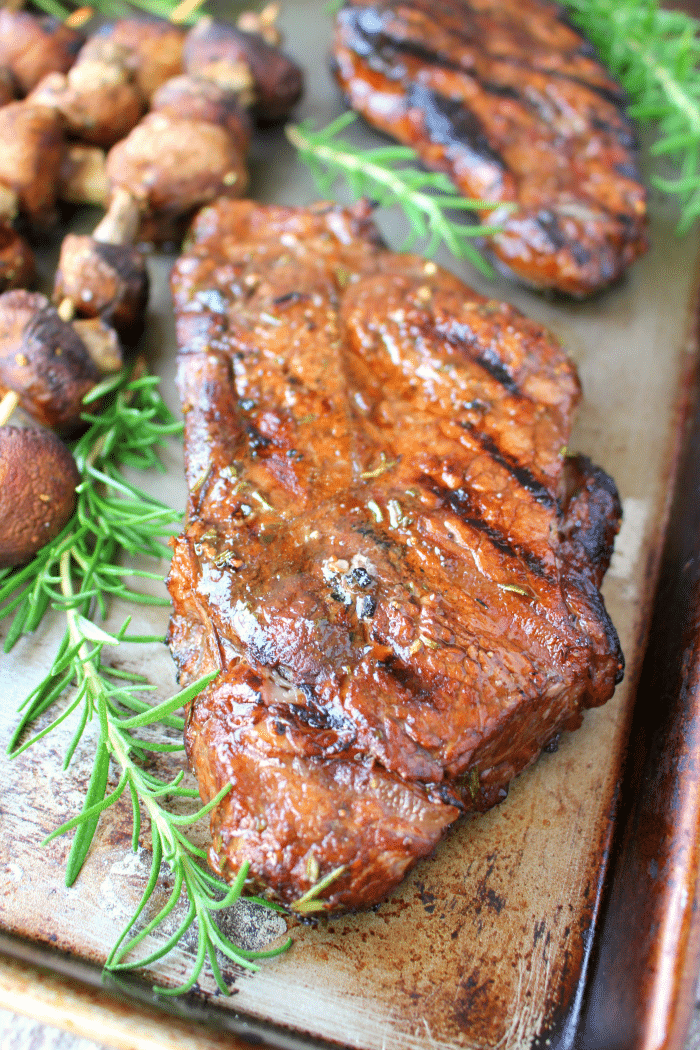 Attention all carnivores - get ready to fire up the grill for these incredibly flavorful steaks! This super simple Balsamic Rosemary marinade is perfect for t-bones, porterhouse, rib-eye, strip steak, flank steak, sirloin and even filet! Paired with grilled mushrooms, these flavor-infused steaks will be a new summer favorite!