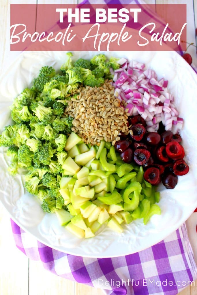 Ingredients in white bowl for broccoli apple salad.