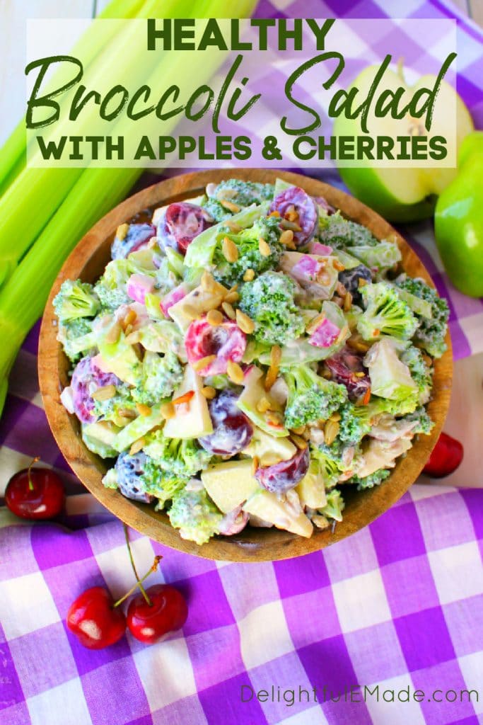 Healthy broccoli salad recipe, broccoli salad with apples and cherries in wood bowl.