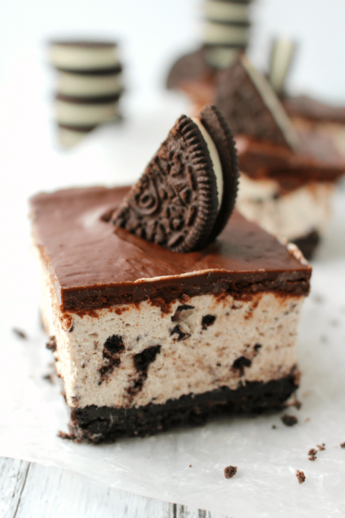 The ultimate dessert for anyone that loves OREO cookies! A thick OREO crust, creamy OREO no-bake cheesecake filling, and topped with a delicious layer of chocolate. This easy, no-bake dessert is perfect for just about any occasion!