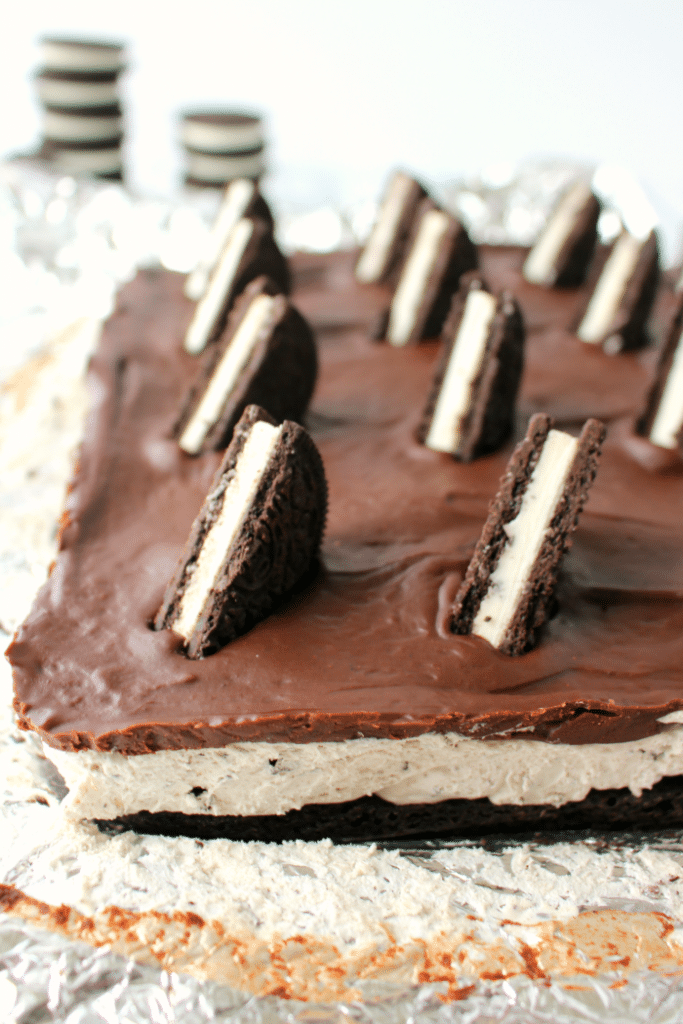 The ultimate dessert for anyone that loves OREO cookies! A thick OREO crust, creamy OREO no-bake cheesecake filling, and topped with a delicious layer of chocolate. This easy, no-bake dessert is perfect for just about any occasion!