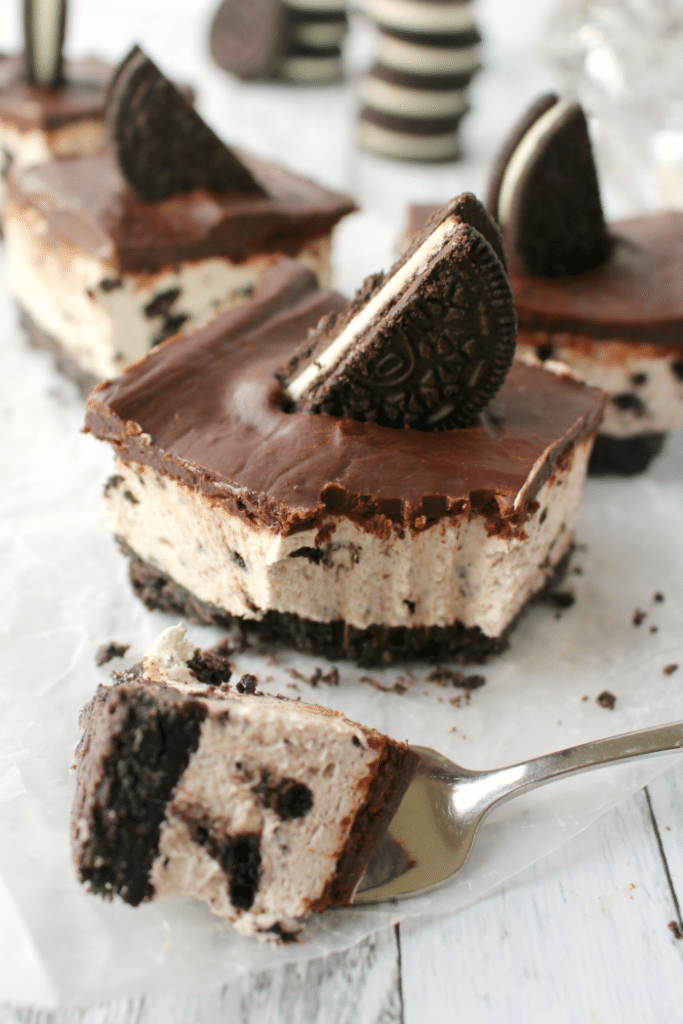 The ultimate dessert for anyone that loves OREO cookies! A thick OREO crust, creamy OREO no-bake cheesecake filling, and topped with a delicious layer of chocolate. This easy, no-bake dessert is perfect for just about any occasion!