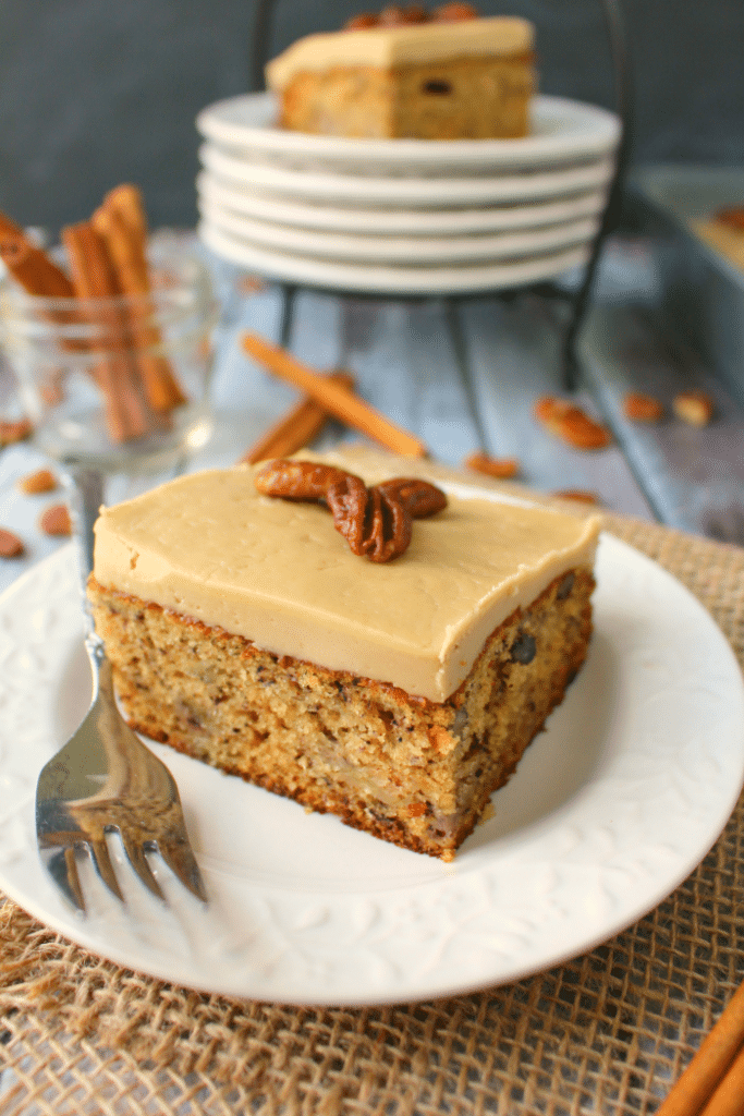 A classic banana cake brought to a whole new level! Moist, sweet cake baked with pecans and topped with a delicious maple frosting, and brown sugar glazed pecans, this cake is perfect for any and every occasion!