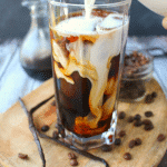 Forget the morning rush at your local coffee shop - make your favorite iced coffee drink right at home! My Vanilla Bean Iced Coffee is made with a super-simple vanilla bean syrup, as well as cold brew coffee, and half and half. An amazing drink to start your day!