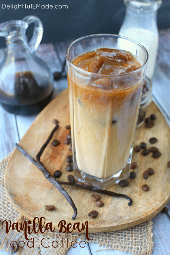 Forget the morning rush at your local coffee shop - make your favorite vanilla iced coffee drink right at home!  My Vanilla Bean Iced Coffee is made with a super-simple vanilla bean syrup, as well as cold brew coffee, and half and half.  An amazing drink to start your day!