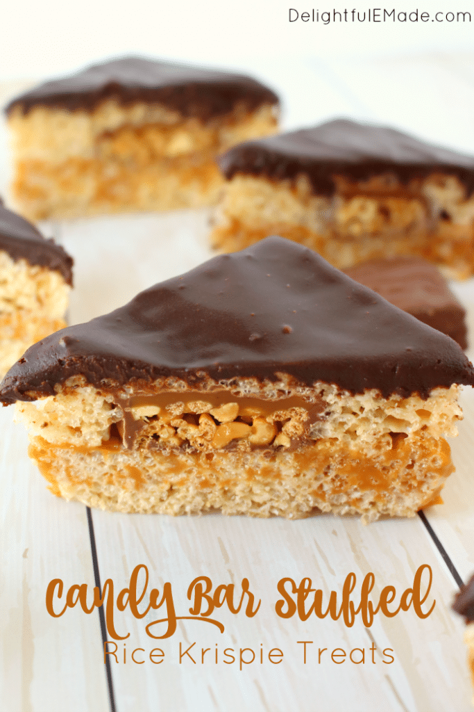 Cereal treats brought to a whole new glorious level! These Candy Bar Stuffed Rice Krispie Treats are loaded with SNICKERS® Crisper bars, gooey caramel, all between layers of marshmallow cereal treats and topped with a thick layer of chocolate! These bars are the ultimate game time treat!