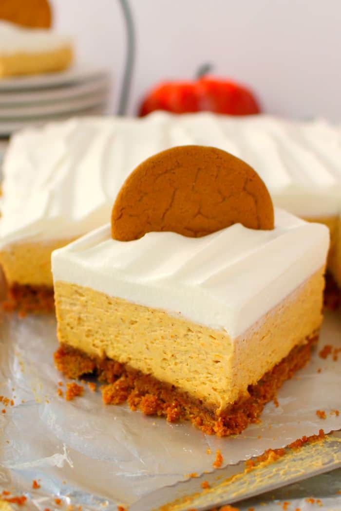 Let me introduce you to your new favorite fall dessert!  Made with a Gingersnap Cookie Crust, whipped topping and a few other goodies, these Pumpkin Cheesecake Bars are simple enough for a casual fall celebration and decadent enough for Thanksgiving dinner!