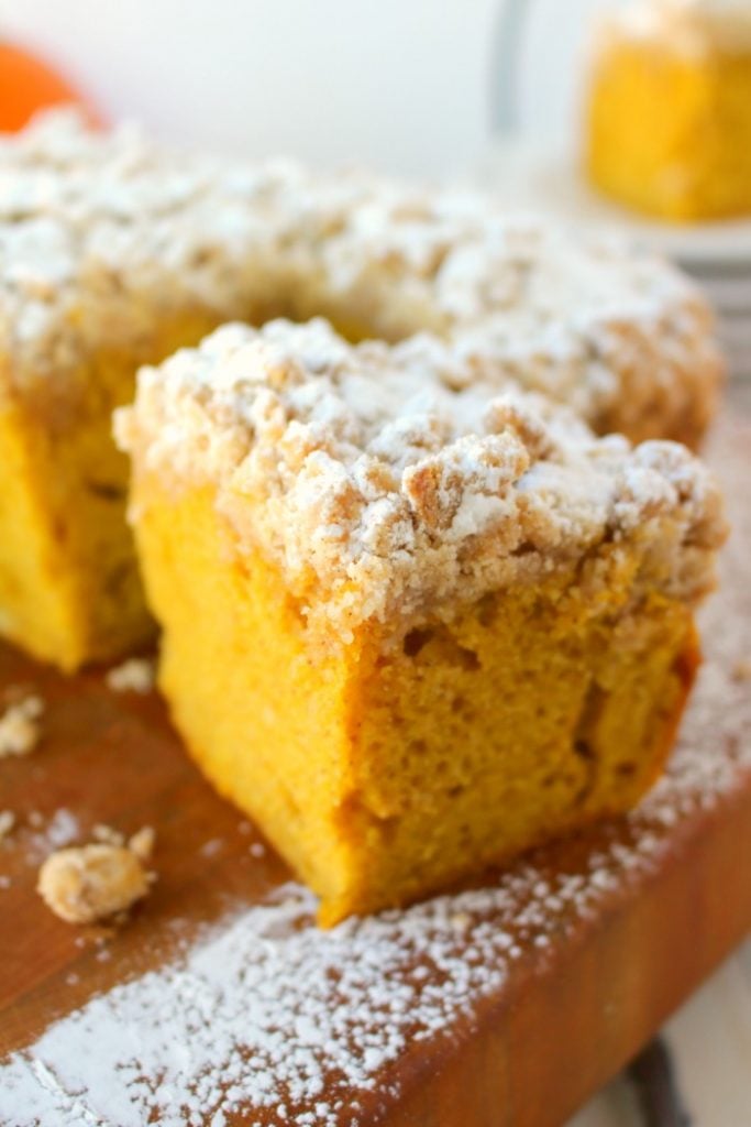 Meet your new favorite crumb cake recipe!  This incredibly moist, velvety pumpkin crumb cake has all your favorite fall flavors topped with an amazing cinnamon crumble.  It's the perfect pumpkin coffee cake to serve on Thanksgiving morning, or simply enjoy with your pumpkin spice latte!