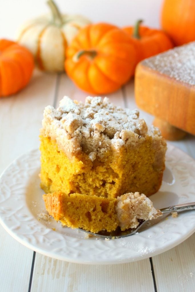 Meet your new favorite crumb cake recipe!  This incredibly moist, velvety pumpkin crumb cake has all your favorite fall flavors topped with an amazing cinnamon crumble.  It's the perfect pumpkin coffee cake to serve on Thanksgiving morning, or simply enjoy with your pumpkin spice latte!