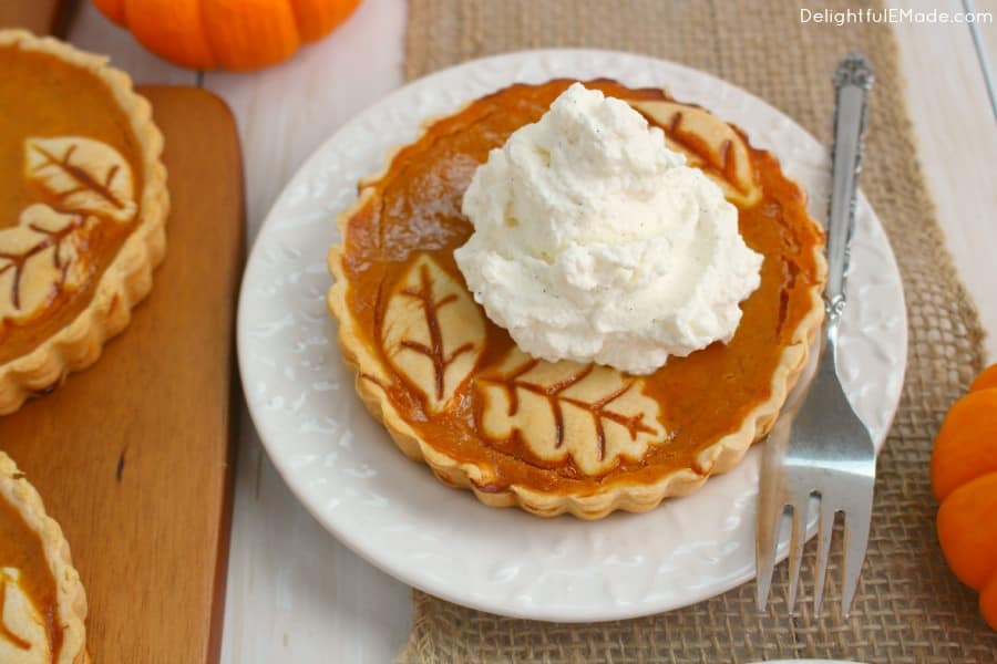 The perfect Thanksgiving or Christmas dessert! These easy tarts are just like pumpkin pie, but when made in small tart pans, they become the most beautiful individual dessert for your holiday meal! Topped with delicious vanilla bean whipped cream, your guests will be dazzled!