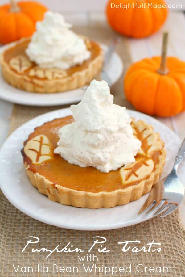 These easy Pumpkin Pie Tarts are just like classic pumpkin pie, but when made in small tart pans, they become the most beautiful individual dessert for your holiday meal!  Topped with delicious vanilla bean whipped cream, your guests will be dazzled!