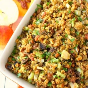Thanksgiving stuffing with apples, sausage and mushrooms in a baking dish.