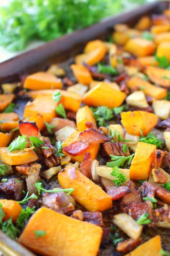 One of the most flavorful, delicious ways to prepare Roasted Butternut Squash!  Roasted with apples, bacon, pecans and shallots, this savory and slightly sweet side-dish is easy enough for a weeknight meal, and fancy enough to accompany your Thanksgiving or Christmas dinner!