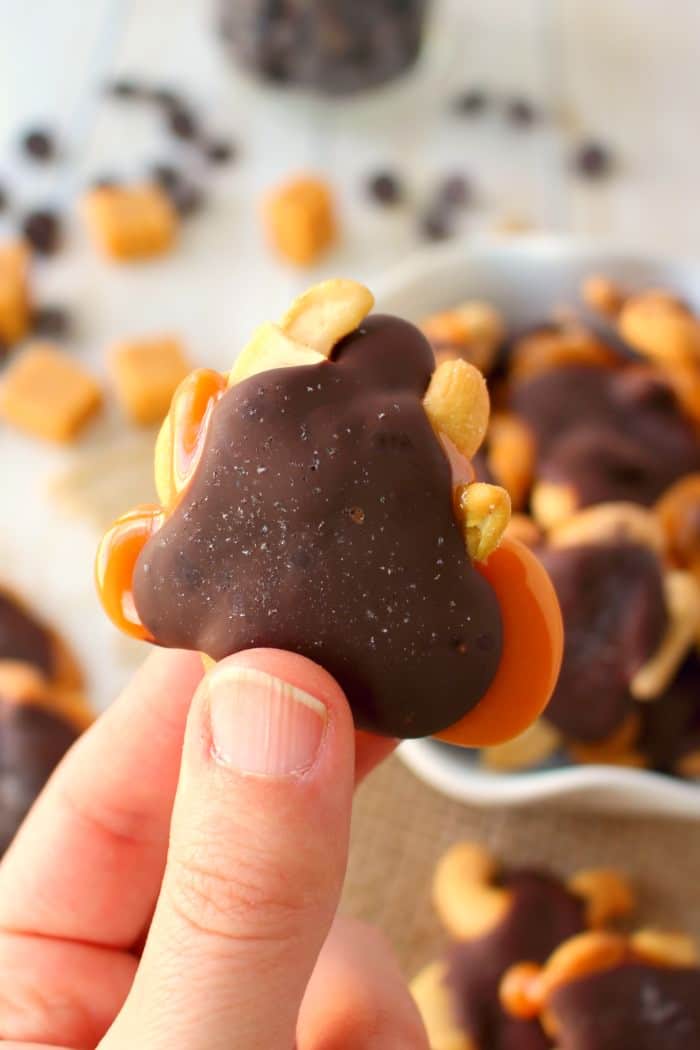 Salty and sweet come together for the most amazing gooey treat! These Chocolate Caramel Cashew Clusters are simply made with just four ingredients, making them the perfect Christmas candy! Fantastic for gifting, cookie exchanges, holiday parties or anytime you need to satisfy your sweet tooth!