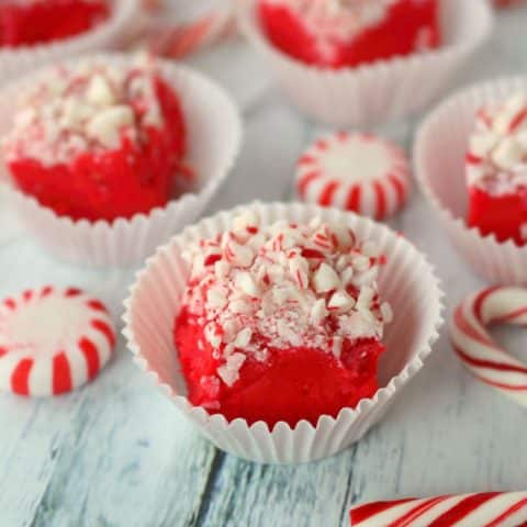Gorgeous red velvet fudge topped with crushed peppermints is the perfect way to ring in the holiday season! This delicious fudge recipe is perfect for your holiday candy trays, cookie exchanges and Christmas parties!