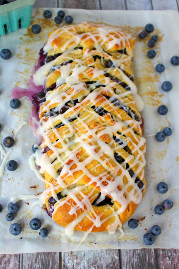 Blueberry cream cheese breakfast braid glazed with fresh blueberries.