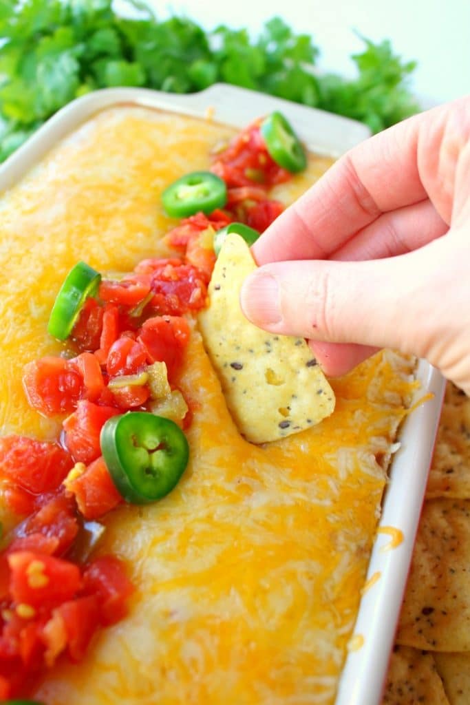 Jalapeno Popper Dip doesn't get much better than this! Made with Ro*Tel and Rosarita Refried Beans this hot cream cheese bean dip recipe is perfect for game day or anytime you want a delicious dip for snacking.