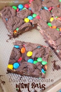 Made with the help of a cake mix and a few other ingredients, these Double Chocolate M&M Bars are fantastic! Loads of milk chocolate M&M's candies and semi-sweet chocolate chips are in the center of these cookie bars, sandwiched between the cake mix batter. Perfect for an after-school snack or a lunchbox surprise!