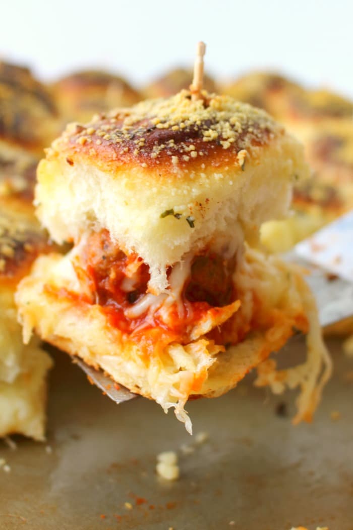 Football food doesn't get much better than this! Like a mini version of a meatball sub, these amazing Parmesan & Mozzarella Meatball Sliders are the perfect party food! Super-simple to make, this easy slider recipe is great for serving at your next watch party and also makes for a great pot-luck dish.