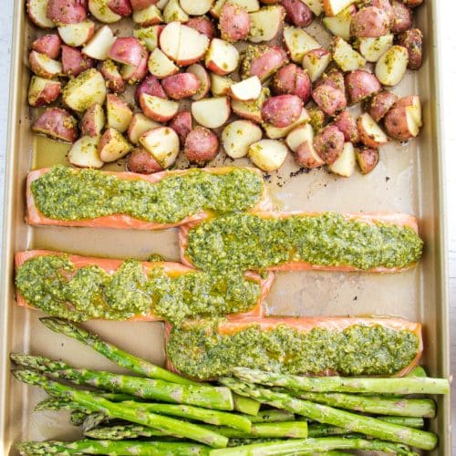 Sheet Pan salmon and asparagus with pesto and potatoes.