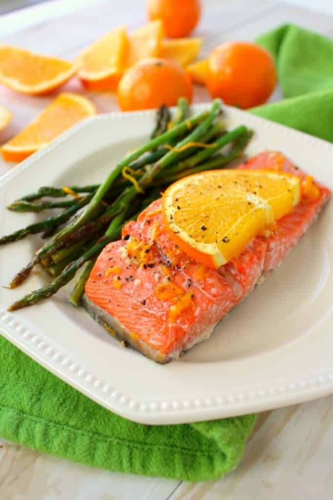 A wonderfully healthy, easy and delicious salmon recipe! Amazing flavors of oranges, lemon and lime glaze these salmon fillets, and when roasted with asparagus spears, it quickly becomes a super flavorful one pan meal. Healthy dinner ideas don't get much easier or delicious than this!