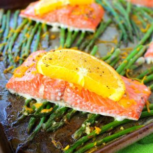 A wonderfully healthy, easy and delicious salmon recipe! Amazing flavors of oranges, lemon and lime glaze these salmon fillets, and when roasted with asparagus spears, it quickly becomes a super flavorful one pan meal. Healthy dinner ideas don't get much easier or delicious than this!