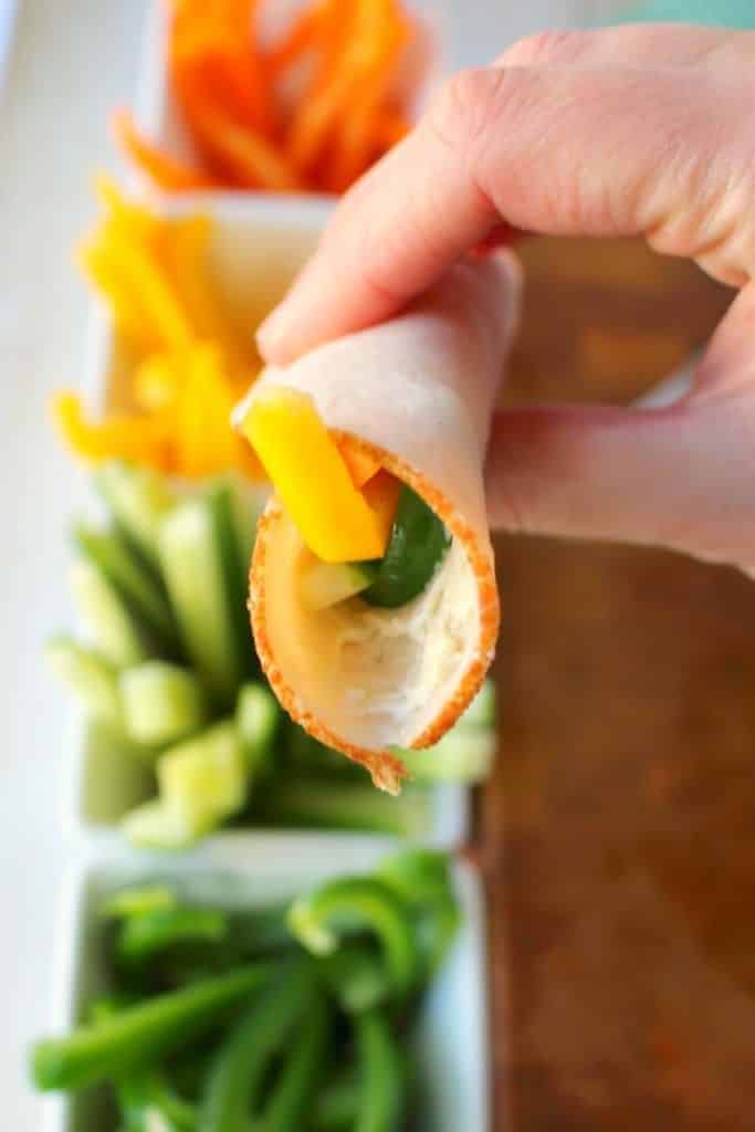 These super simple turkey wraps are the ultimate snack or light lunch when you're looking to make healthier choices! Uses simple deli turkey, fresh sliced peppers and cucumbers and a wedge of Laughing Cow Cheese. Just 3 Weight Watchers Smart Points!!