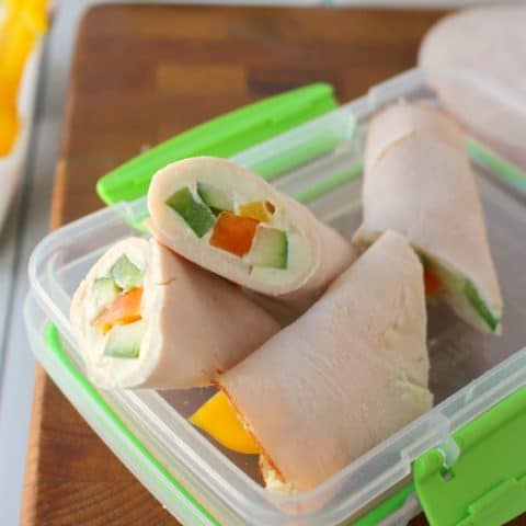 These super simple turkey wraps are the ultimate snack or light lunch when you're looking to make healthier choices! Uses simple deli turkey, fresh sliced peppers and cucumbers and a wedge of Laughing Cow Cheese. Just 3 Weight Watchers Smart Points!!