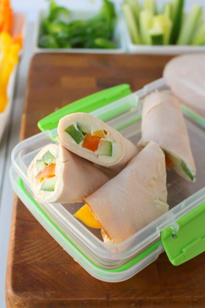 These super simple turkey wraps are the ultimate snack or light lunch when you're looking to make healthier choices! Uses simple deli turkey, fresh sliced peppers and cucumbers and a wedge of Laughing Cow Cheese. Just 3 Weight Watchers Smart Points!!