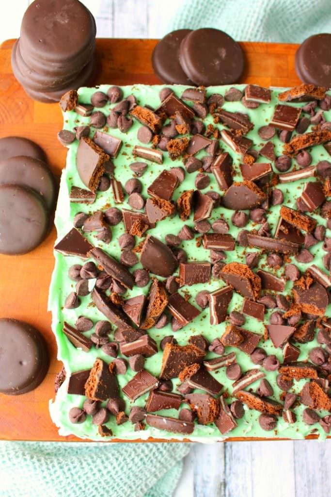 Let me introduce you to your new favorite brownie recipe! A perfect combination of chocolate and mint, these fudgy mint brownies are topped with Girl Scout Thin Mint Cookies, Andes mints, chocolate chips, and an amazing layer of mint butter cream frosting. Most definitely a brownie lover's dream come true!