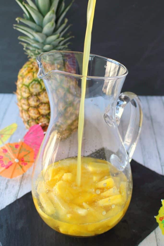 This Pina Colada recipe will be your new favorite happy hour drink! Made with four simple ingredients, this fantastic champagne punch is perfect for parties, showers, and girls nights! Forget the blender, this amazing pineapple coconut cocktail is super easy and completely delicious!