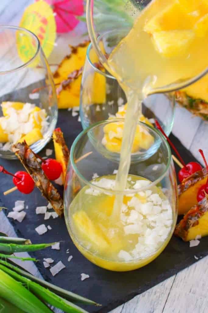 This Pina Colada recipe will be your new favorite happy hour drink! Made with four simple ingredients, this fantastic champagne punch is perfect for parties, showers, and girls nights! Forget the blender, this amazing pineapple coconut cocktail is super easy and completely delicious!