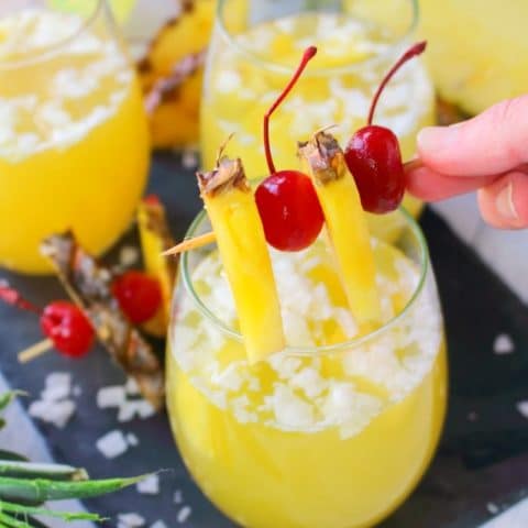 This Pina Colada recipe will be your new favorite happy hour drink! Made with four simple ingredients, this fantastic champagne punch is perfect for parties, showers, and girls nights! Forget the blender, this amazing pineapple coconut cocktail is super easy and completely delicious!