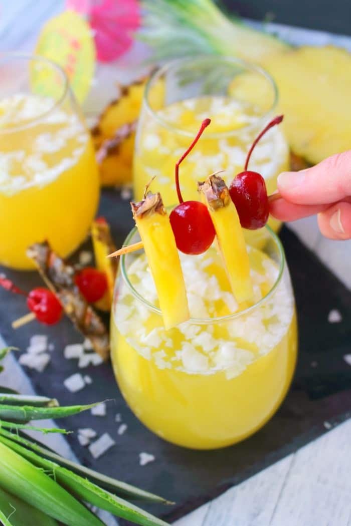 This Pina Colada recipe will be your new favorite happy hour drink! Made with four simple ingredients, this fantastic champagne punch is perfect for parties, showers, and girls nights! Forget the blender, this amazing pineapple coconut cocktail is super easy and completely delicious!