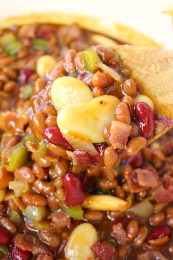 The classic baked beans recipe got an awesome upgrade! These Bacon Lovers Baked Beans and loaded with 1 pound of crisp, delicious bacon along with three types of beans, peppers onions and an amazing sauce. Made in the oven or slow cooker, this easy side dish is a must-have for any cookout, pot-luck, tailgate party or picnic!