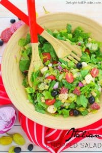 If you love Italian anitpasto, then this chopped salad recipe is right up your alley! Loaded with fresh romaine lettuce, mozzarella, olives, salami and more, this incredible anitpasto salad will quickly become a family favorite for every potluck, cookout, and picnic this summer!