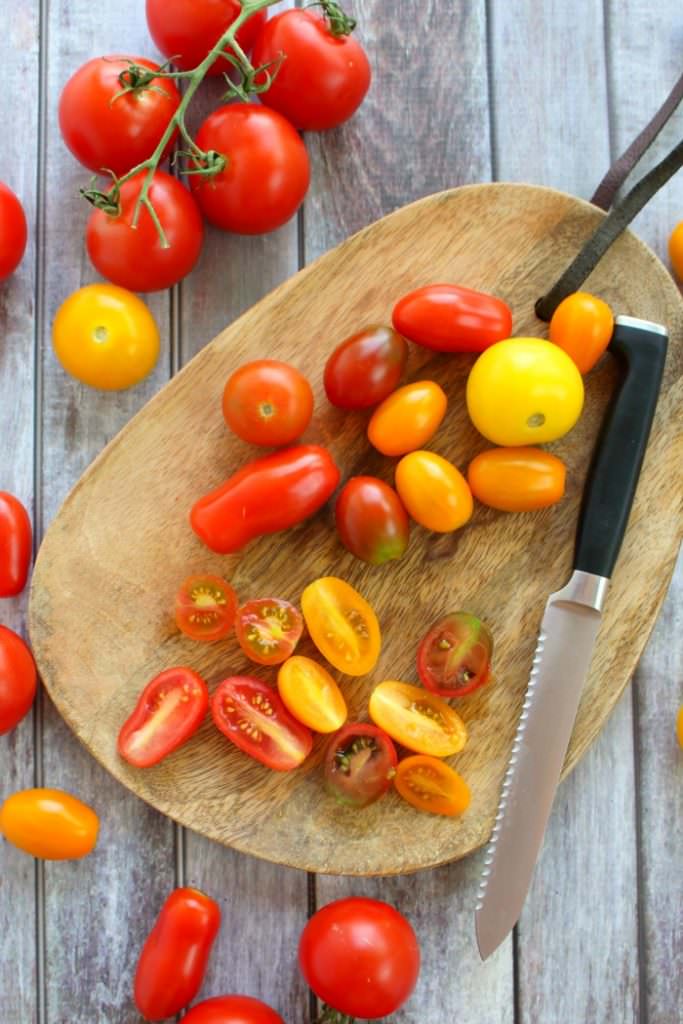 With just 6 ingredients, this simple tomato salad recipe will be your new go-to summer side!  Made with fresh cherry tomatoes, mozzarella, basil and a 3 ingredient balsamic vinaigrette, this caprese salad takes just minutes to make and tastes incredible!