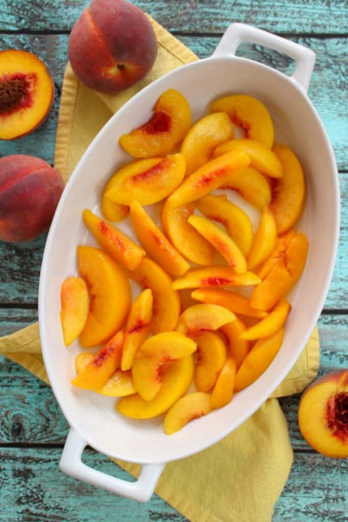 Just 4 ingredients is all you need to make this fantastic Cake Mix Peach Cobbler! Made in less time it takes to preheat the oven, this fantastic peach dessert is perfect anytime you're in the mood for old fashioned cobbler!