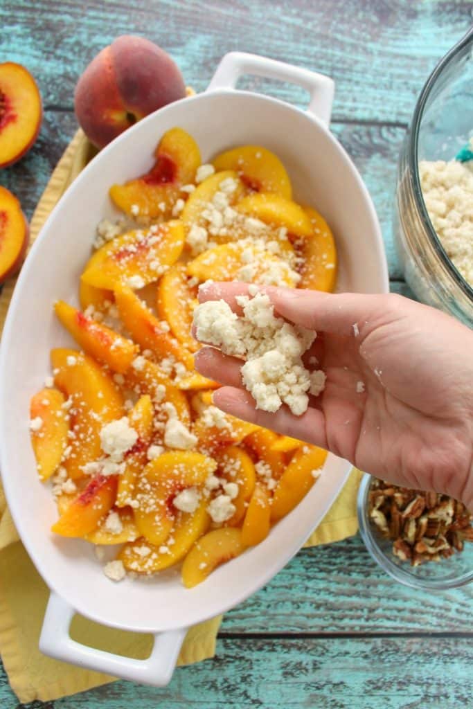 Just 4 ingredients is all you need to make this fantastic Cake Mix Peach Cobbler! Made in less time it takes to preheat the oven, this fantastic peach dessert is perfect anytime you're in the mood for old fashioned cobbler!