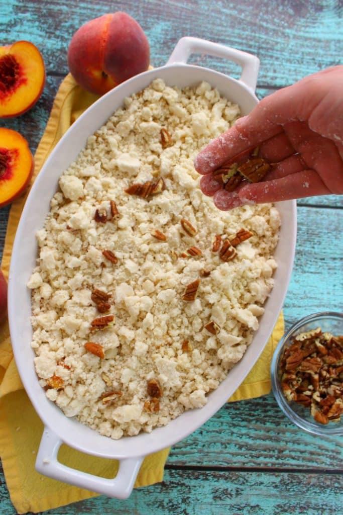 Just 4 ingredients is all you need to make this fantastic Cake Mix Peach Cobbler! Made in less time it takes to preheat the oven, this fantastic peach dessert is perfect anytime you're in the mood for old fashioned cobbler!