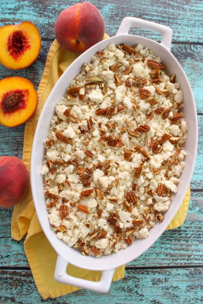 Just 4 ingredients is all you need to make this fantastic Cake Mix Peach Cobbler! Made in less time it takes to preheat the oven, this fantastic peach dessert is perfect anytime you're in the mood for old fashioned cobbler!