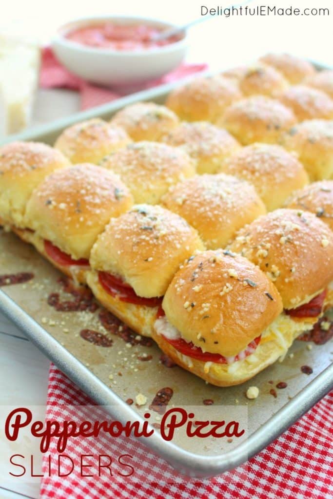 Loaded with layers of pepperoni and mozzarella cheese, these Pepperoni Pizza Sliders are the perfect party food!  Fantastic for watch parties, tailgating, holiday parties and more, these hot mini sandwiches are easy to make and taste incredible!